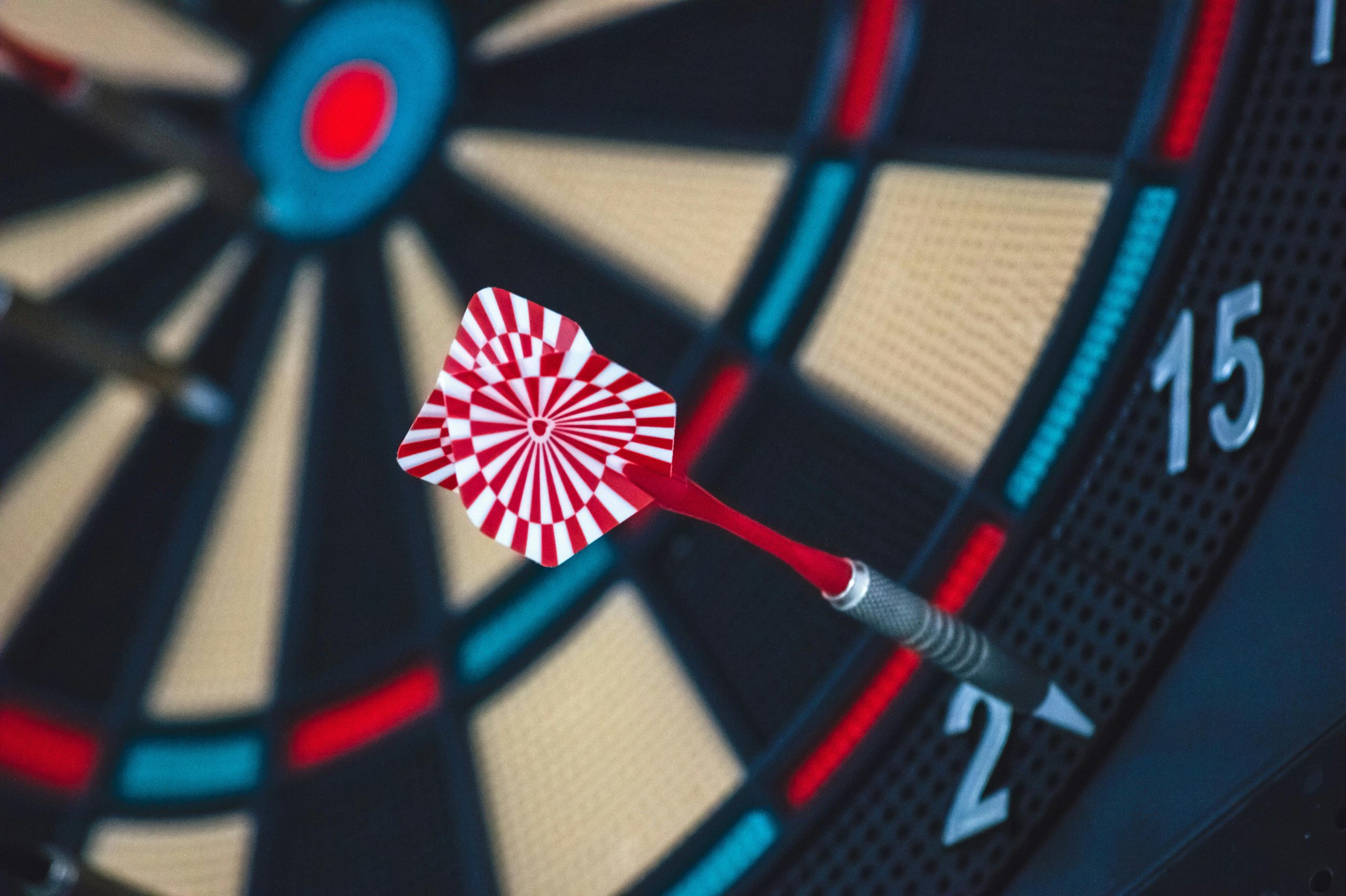 a dart in the center of a dart board