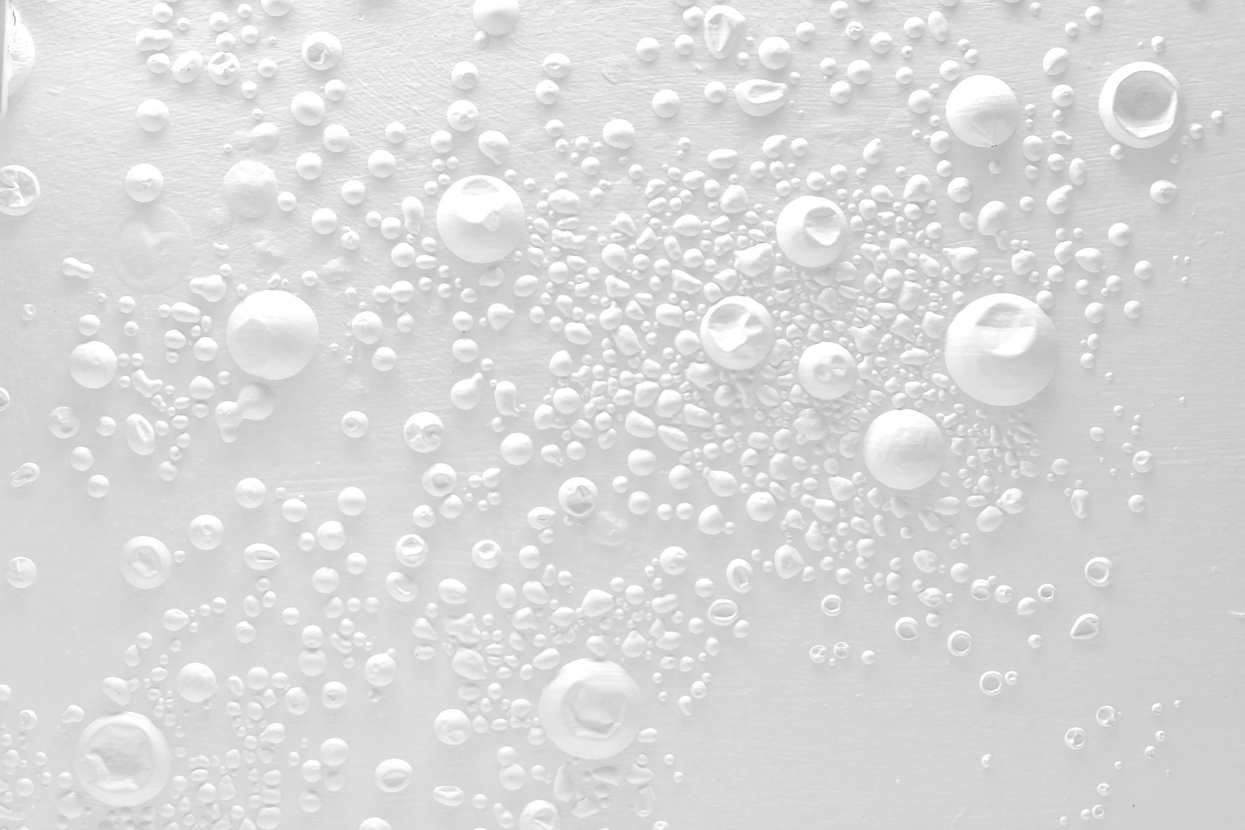 a white surface with many bubbles